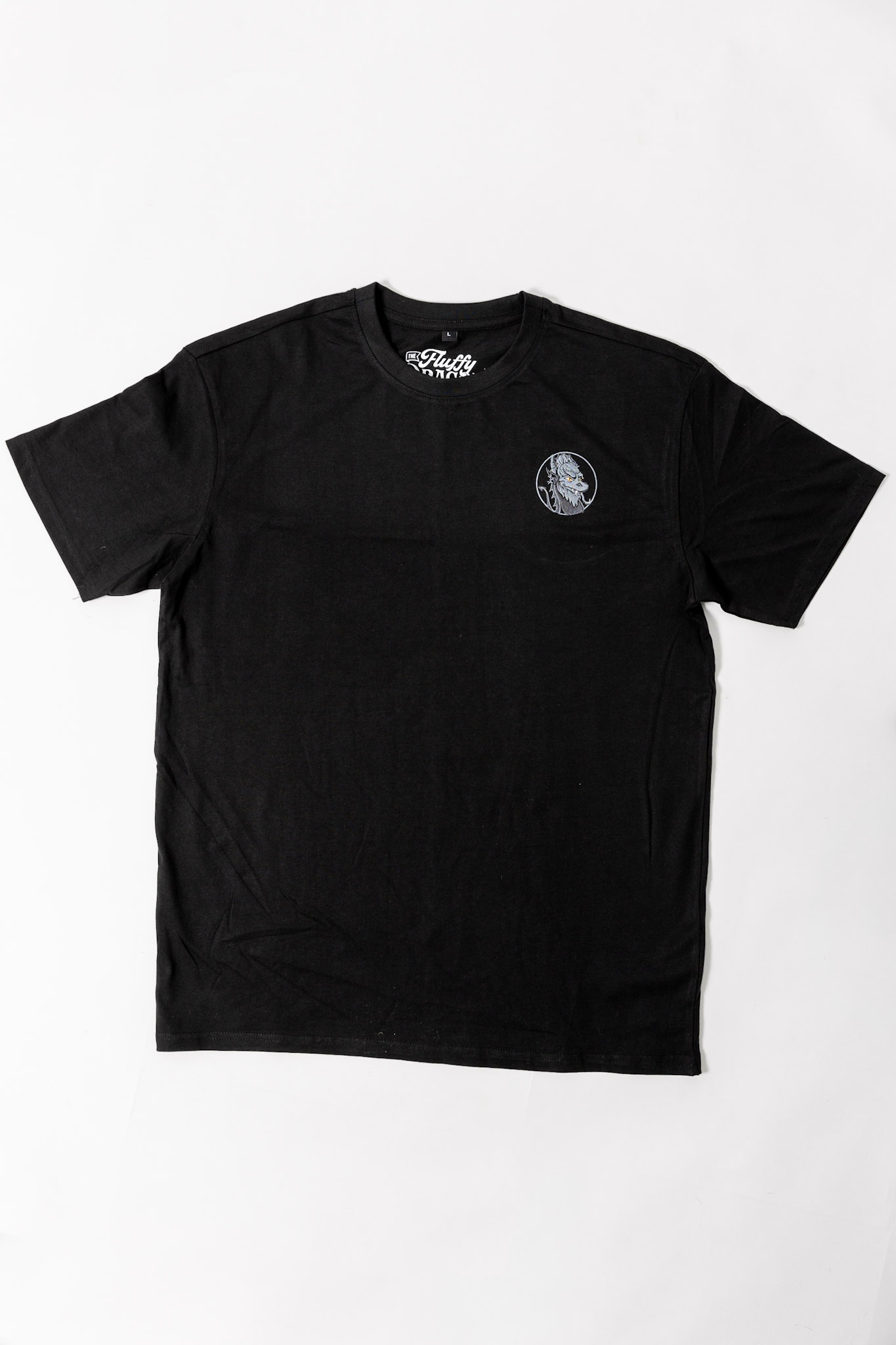 A black oversized tee with The Fluffy Dragon Co logo